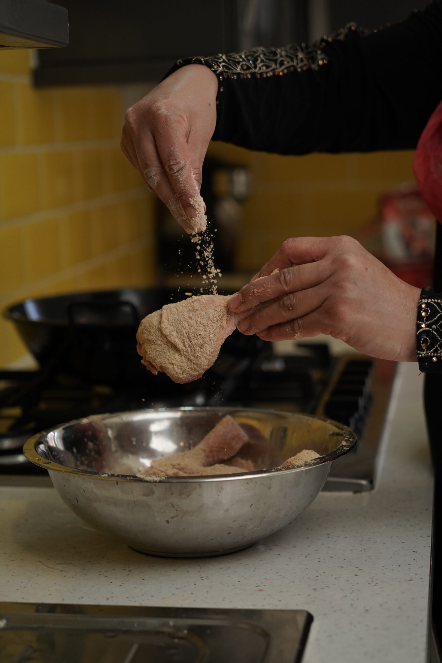 Close-up of Ever East dry tandoori masala marinade coating chicken pieces before cooking i