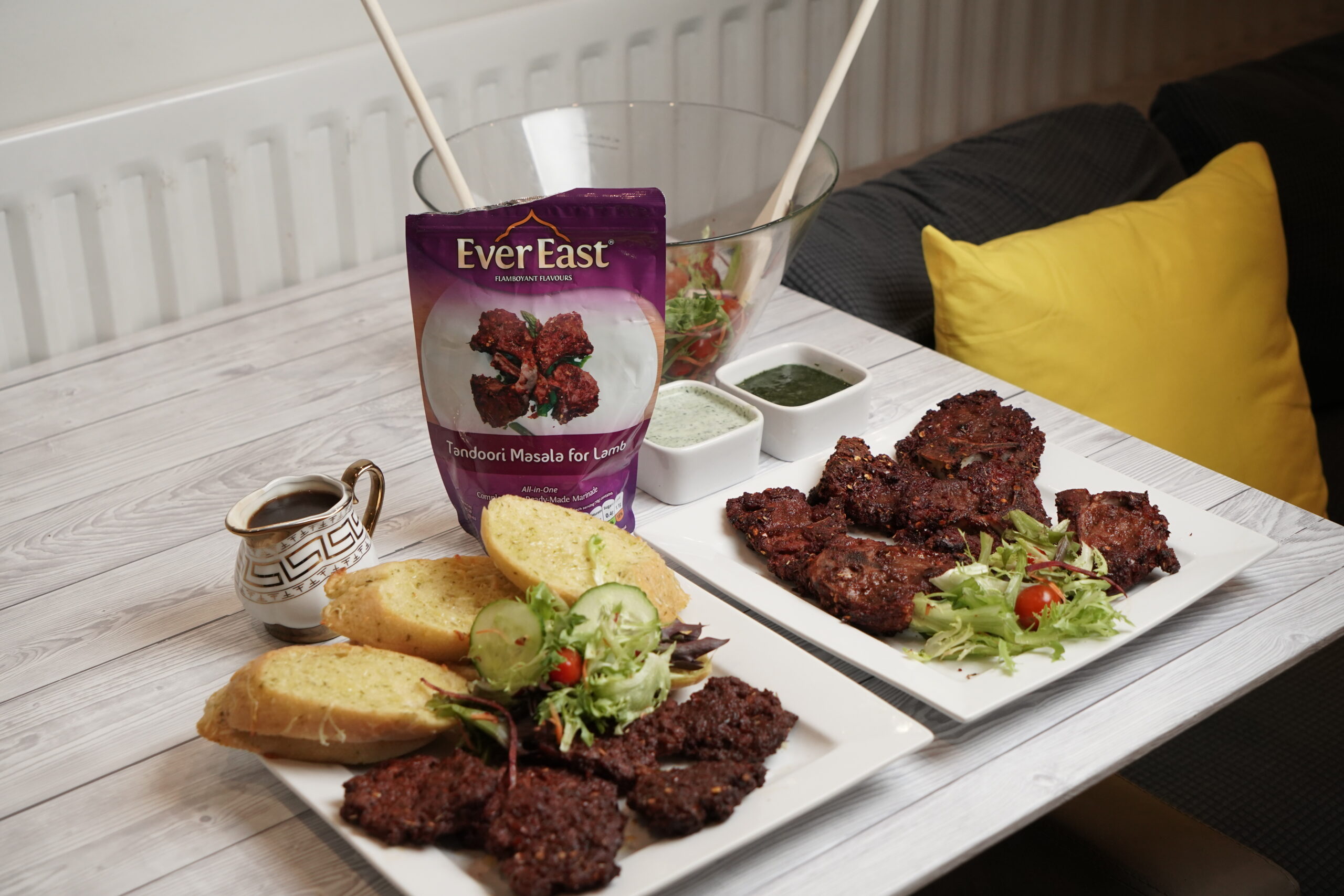 Founder-inspired Ever East home kitchen scene with dry tandoori marinade, spices, cooked c
