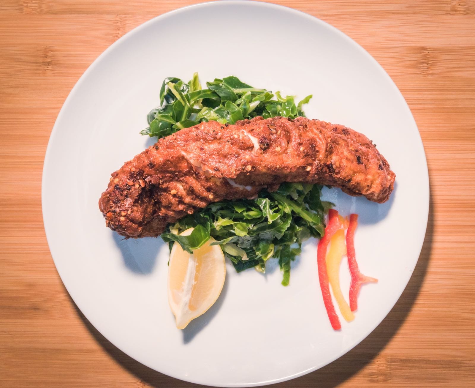 Ever East tandoori masala fish fillets with lemon wedges, rice and fresh salad for a light