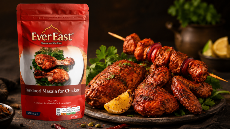 EverEast Tandoori Masala for Chicken spice packet beside grilled tandoori chicken and kebab skewers